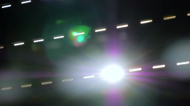 Close up: sun light is shining through the window blinds - view from dark room: sun lens flare, sun rays, selective focus. Morning, indoors, b-roll and abstract concept