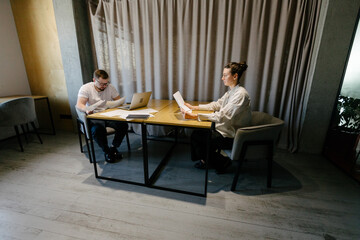 Business meeting or two people working in office