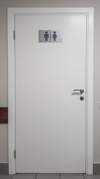 the door of a modern toilet in a public place with convenient and understandable designations