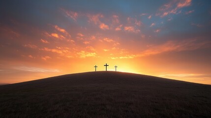 Obraz premium A serene landscape with three dark silhouetted crosses standing atop a hill framed by a stunning fiery sunset sky with dramatic cloud formations creating a powerful and inspiring spiritual scene
