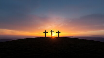 Three crosses silhouetted against the vibrant colors of a majestic sunset creating a serene and spiritual atmosphere on the hilltop