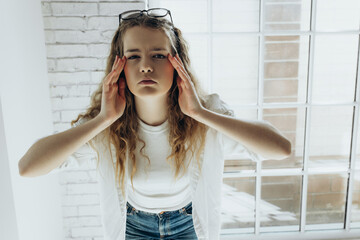 Poor vision. Young woman with glasses, girl with poor vision on white background