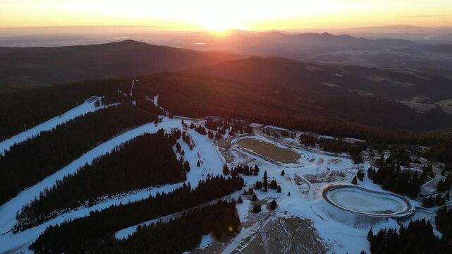 Aerial drone morning view of ski resort Rogla at sunrise dawn. Panoramic winter shot of Ski center Rogla, Slovenia
