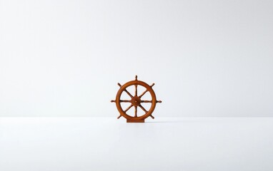Small Brown Wooden Ship Wheel on White Surface
