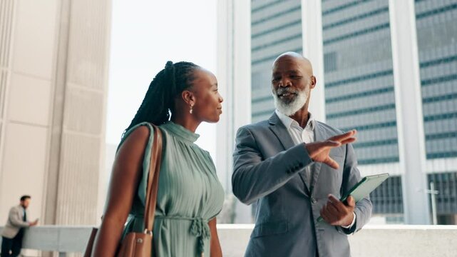Teamwork, talking and planning with business people in city for proposal discussion, mentor and collaboration. Walking, partnership and conversation with African employees outdoor for chat and idea