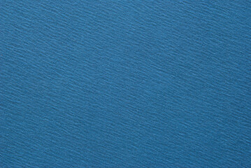 A sheet of blue creased effect cardboard texture as background