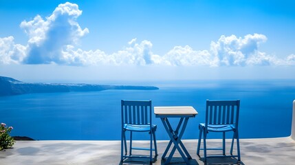 Obraz premium Santorini Greece Scenic View with Blue Chairs and Table