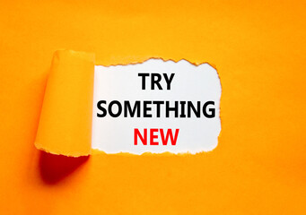 Try something new symbol. Concept words Try something new on beautiful white paper. Beautiful orange paper background. Business motivational lifestyle try something new concept. Copy space.