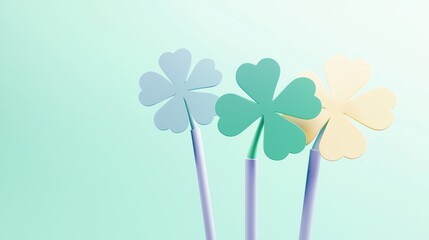 Three colorful clover shapes on sticks against a soft pastel background, symbolizing luck and celebration.