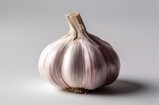 A close-up of a garlic on white background