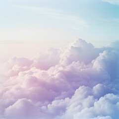 Pastel pink and purple cumulus clouds in a clear blue sky.