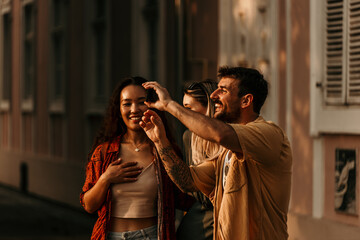 Young adults exploring the city, enjoying summer vibes and good company.