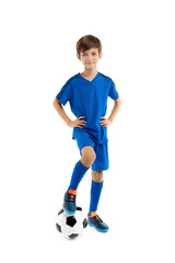Young boy soccer player, in blue sport outfit holding leg on classic soccer ball over white background