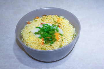 Isolated Close up ramen soup with onion and egg 