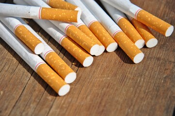 cigarettes on a wooden table. smoking problems