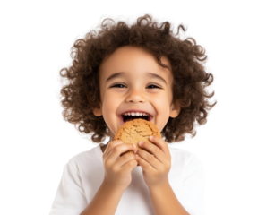 Happy curly-haired boy laughing while holding a cookie, isolated on a white background