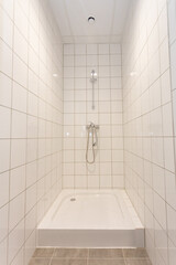 Experience the beauty of a Modern Minimalist Shower featuring an Elegant Tile Design that impresses