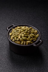 Peeled pumpkin seeds in a bowl, an ingredient for making vegetarian food