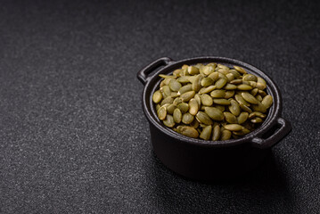 Peeled pumpkin seeds in a bowl, an ingredient for making vegetarian food