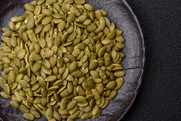 Peeled pumpkin seeds in a bowl, an ingredient for making vegetarian food