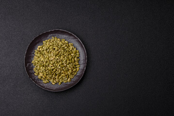 Peeled pumpkin seeds in a bowl, an ingredient for making vegetarian food
