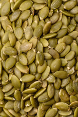 Peeled pumpkin seeds in a bowl, an ingredient for making vegetarian food
