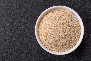 White sesame seeds in a bowl, an ingredient for making vegetarian food