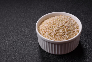 White sesame seeds in a bowl, an ingredient for making vegetarian food