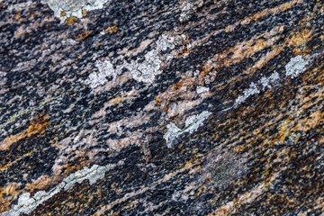  Close-up of natural stone patterns, showcasing unique textures, cracks, and organic formations. Ideal for background and texture