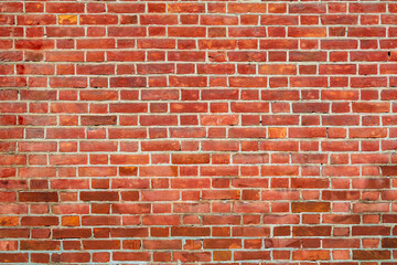 Red brick wall texture, perfect for background use, featuring uniform bricks and natural color variations