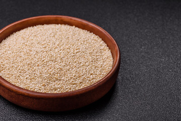 White sesame seeds in a bowl, an ingredient for making vegetarian food