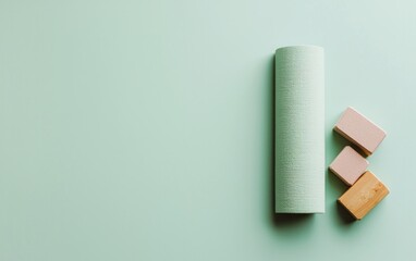 Obraz premium Pastel Blocks and Textured Mat on Green Background