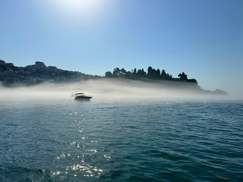 Morning fog over Adriatic sea in Montenegro Ulcinj town.