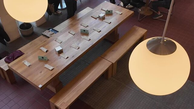 Table setting a reserved table in a cafe. Preparing for the arrival of visitors