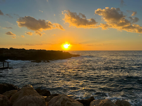 Sunset on Kissonerga beach in Paphos district of Cyprus on the Mediterranean Sea