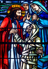 Obraz premium Stained glass (1930) of Jesus Miracle: the Resurrection of Lazarus.