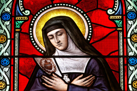 Stained glass (19th century) of St. Margaret Mary Alacoque who promoted devotion to the Sacred Heart of Jesus. .