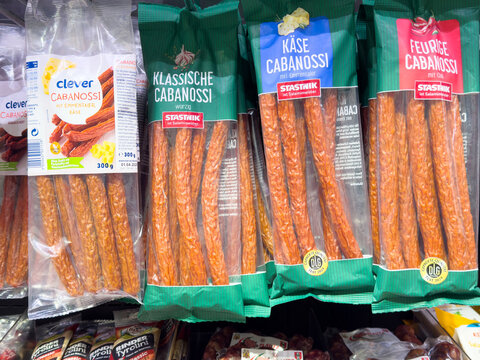 Assorted cabanossi sausages in supermarket display