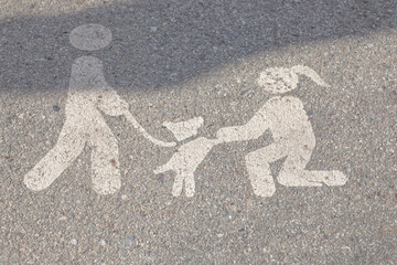 Top view of modern white pedestrian sign on concrete road, sign for pedestrian and dog place