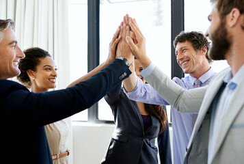 Happy, business people and meeting with high five for unity, mission or teamwork together at...