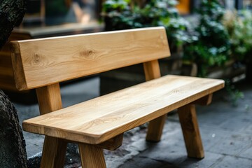 Fototapeta premium Carpenter creates a handcrafted wooden bench for outdoor spaces during daylight