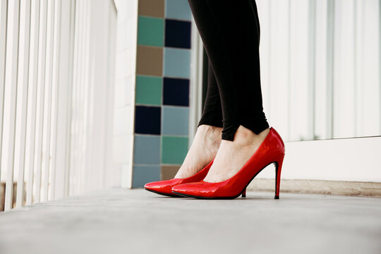 Woman's feet in red high heels