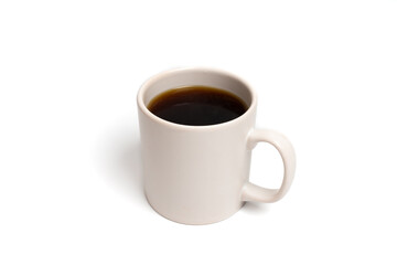Obraz premium White ceramic mug filled with coffee on isolated white background. Close up of hot drink. Morning, relaxation, and beverage concept. Copy space