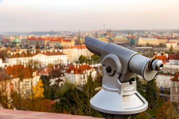 A telescope is pointed at a city Prague in Czech Republic