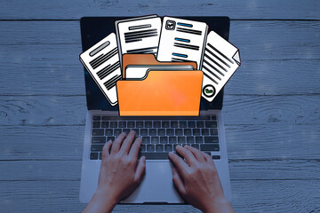 User Organizing Digital Documents and Managing Online Files in a Virtual Folder on Laptop