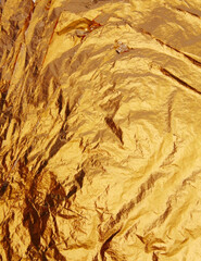 A background pattern showcasing a harmonious blend of colors, including yellow, gold, beige, tan, and brown. This fabric design likely exhibits textures or motifs that complement the warm tones