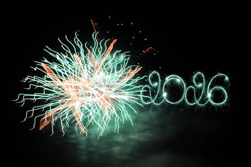 Sparkler 2026. Firework illumination on dark sky background, happy new year 2026 concept. Sparkler 2026 text colorful firework. Happy New Year 2026 firework overlay background. Sparks, fireworks