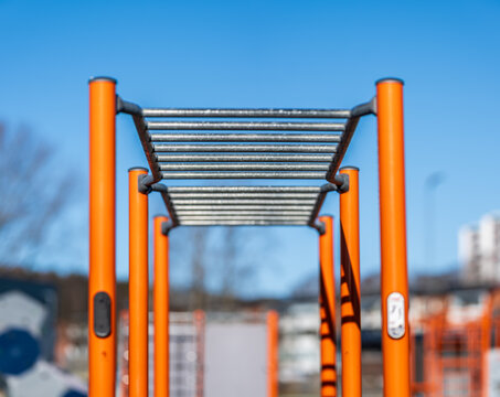 monkey bar structure in outdoor fitness park.