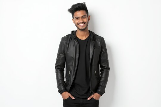 Half-Length (Waist-Up) portrait of young stylish smiling Indian male model in cyberpunk wear isolated on pure white background looking at camera