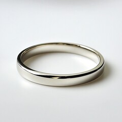 Simple elegance: A close-up of a classic, polished metal band. Perfect for minimalist style.